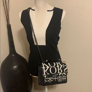 Black and white sleeveless sweater